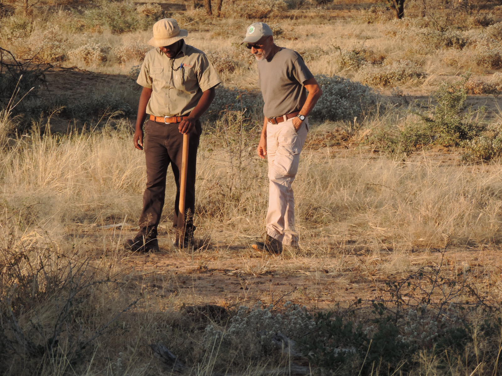 A WildTrack scientist learning to read tracks with an indigenous tracker